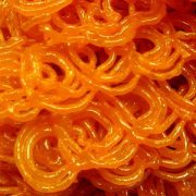 JALEBI A slight chewy interior texture with a crystallized sugary exterior coating