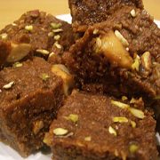 KALA HALVA A rich, dark and luxurious sweet made from an abundant mixture of almonds, cashew nuts, pistachios and cardamoms. A sticky sensation so sweet that you can't stop at one piece.