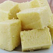 PLAIN BARFI A dense and smooth golden piece of sweet sensation with a delicate and exotic flavour of cardamoms.