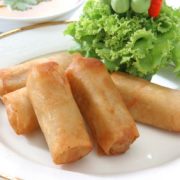 Deep fried cylindrical pastry stuffed rollup with Indian home-made cheese & vegetables